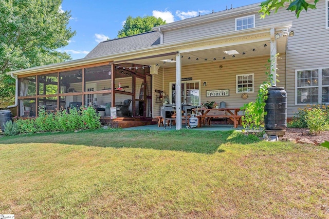 113 Faulkner Cir, Greer, SC 29651 - back of house featuring a lawn, a patio area, and a sunroom