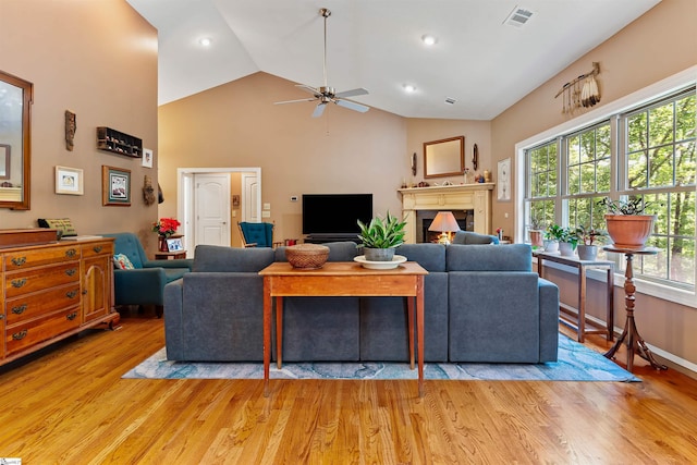 460 Dublin Ln, Columbus, SC 28722 - living room featuring ceiling fan, light wood-style floors, high vaulted ceiling, a warm lit fireplace, and recessed lighting