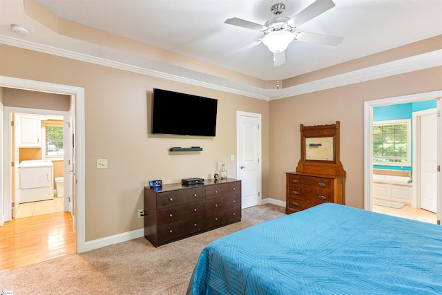 460 Dublin Ln, Columbus, SC 28722 - bedroom featuring washer / dryer, multiple windows, light colored carpet, a tray ceiling, and ornamental molding
