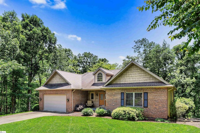 460 Dublin Ln, Columbus, SC 28722 - view of front of house featuring an attached garage, a front yard, brick siding, and driveway