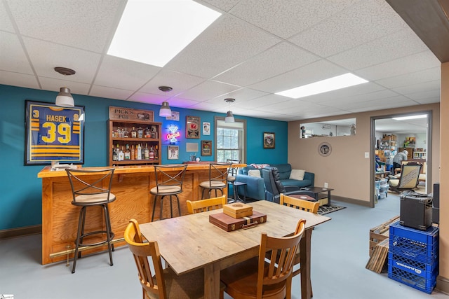 460 Dublin Ln, Columbus, SC 28722 - dining area with a dry bar, a paneled ceiling, and baseboards
