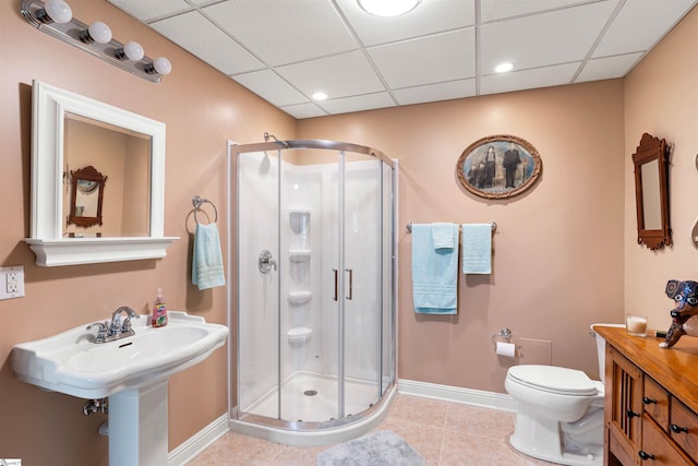 460 Dublin Ln, Columbus, SC 28722 - bathroom featuring baseboards, a paneled ceiling, a stall shower, toilet, and tile patterned floors