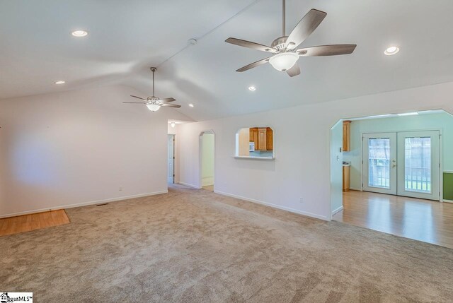 301 S Cassidy Way, Campobello, SC 29322 - unfurnished living room with arched walkways, light colored carpet, ceiling fan, lofted ceiling, and recessed lighting