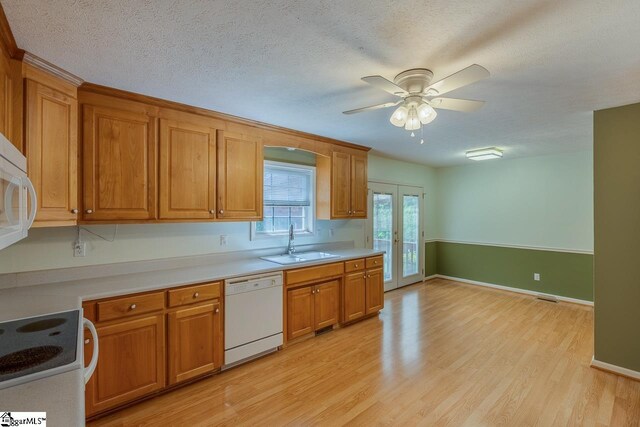 301 S Cassidy Way, Campobello, SC 29322 - kitchen featuring dishwasher, a sink, brown cabinetry, light wood-style flooring, and ceiling fan