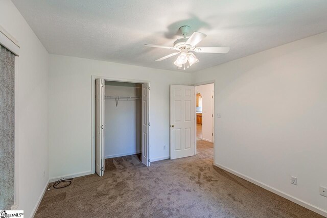 301 S Cassidy Way, Campobello, SC 29322 - unfurnished bedroom featuring carpet flooring, baseboards, a closet, and ceiling fan