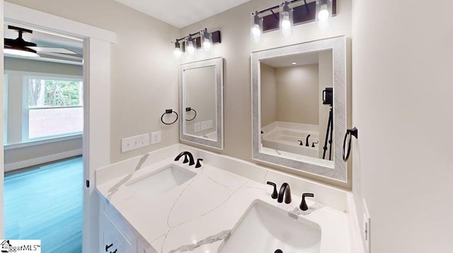 full bathroom featuring a sink and a tub to relax in