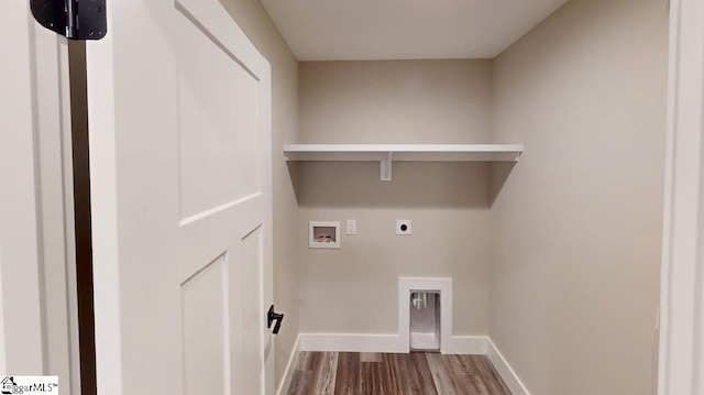 washroom with wood finished floors, hookup for a washing machine, hookup for an electric dryer, and baseboards