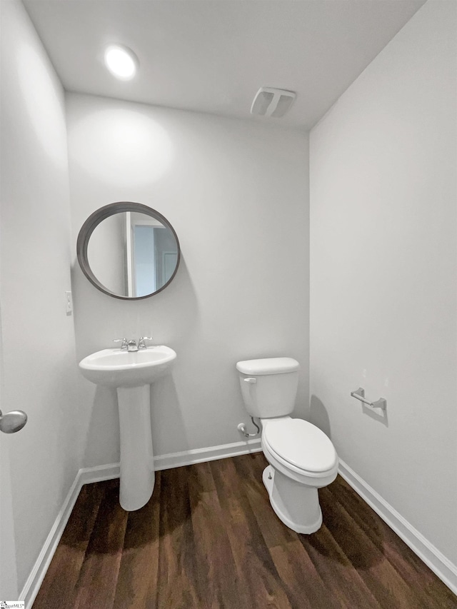 3740 Brookshade Trl, Moore, SC 29369 - bathroom featuring wood finished floors, toilet, baseboards, and a sink