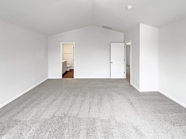 3740 Brookshade Trl, Moore, SC 29369 - unfurnished bedroom featuring dark carpet, vaulted ceiling, baseboards, and connected bathroom