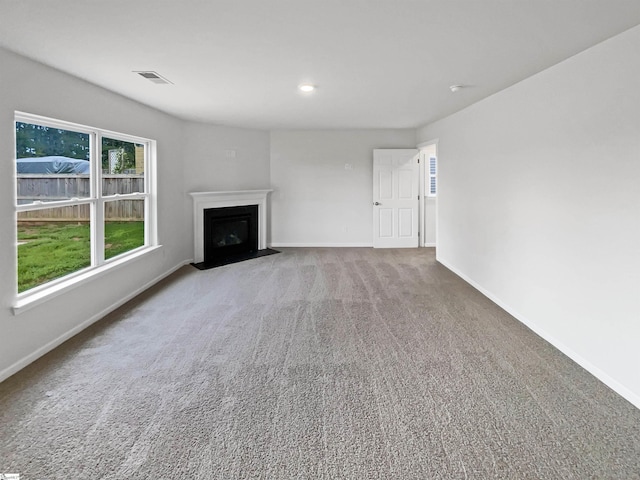 3740 Brookshade Trl, Moore, SC 29369 - unfurnished living room with baseboards, carpet flooring, a fireplace with flush hearth, and recessed lighting