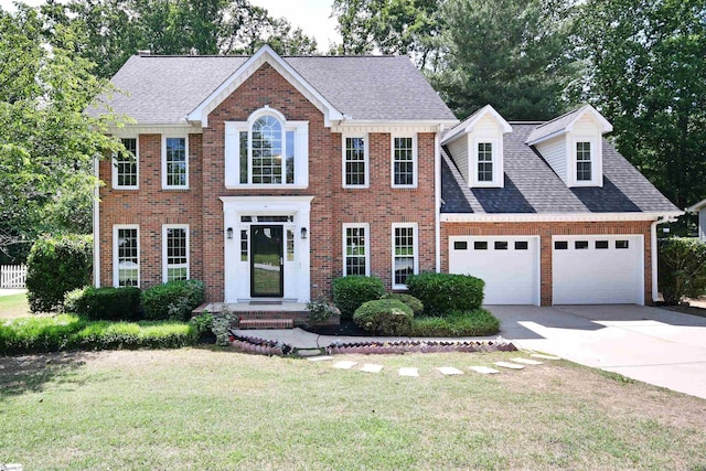 210 Cross Field Rd, Greenville, SC 29607 - colonial inspired home with an attached garage, concrete driveway, brick siding, a front lawn, and roof with shingles
