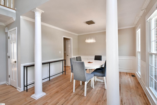 210 Cross Field Rd, Greenville, SC 29607 - dining space featuring ornate columns, ornamental molding, light wood finished floors, a chandelier, and wainscoting
