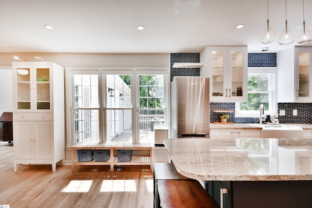 210 Cross Field Rd, Greenville, SC 29607 - kitchen with light wood finished floors, freestanding refrigerator, plenty of natural light, decorative backsplash, and recessed lighting