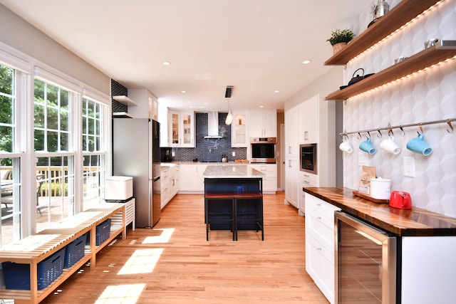 210 Cross Field Rd, Greenville, SC 29607 - kitchen featuring wine cooler, stainless steel appliances, open shelves, wall chimney range hood, and backsplash