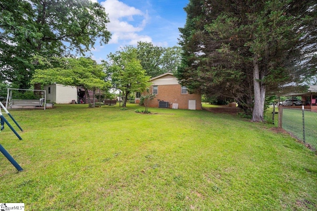 228 Styles Rd, Taylors, SC 29687 - view of yard featuring central AC and an outdoor structure