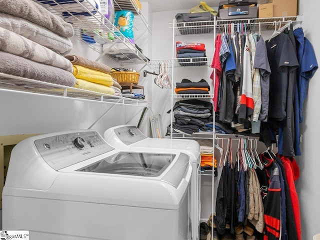 washroom featuring washing machine and dryer