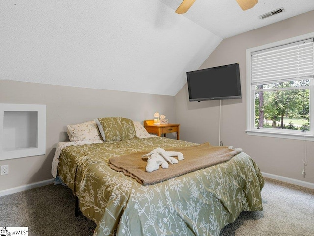 carpeted bedroom with lofted ceiling, baseboards, and a ceiling fan