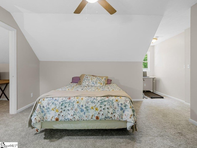 carpeted bedroom with lofted ceiling, baseboards, and ceiling fan