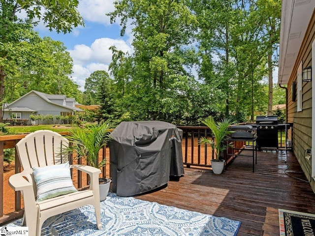 wooden deck with a grill
