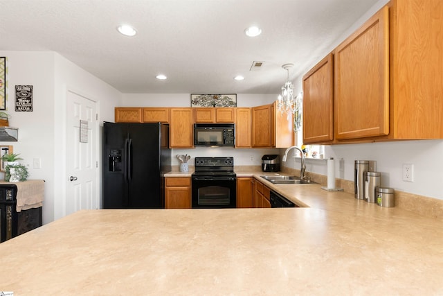 640 Slippery Moss Dr, Spartanburg, SC 29303 - kitchen with black appliances, a sink, light countertops, recessed lighting, and decorative light fixtures