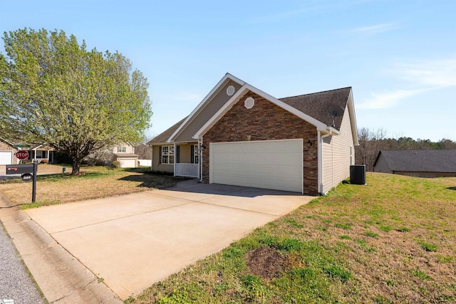 640 Slippery Moss Dr, Spartanburg, SC 29303 - view of front of home with stone siding, an attached garage, central air condition unit, concrete driveway, and a front lawn
