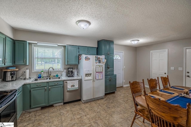 217 Ponder Rd, Greer, SC 29651 - kitchen with white refrigerator with ice dispenser, stainless steel dishwasher, a sink, green cabinetry, and a textured ceiling
