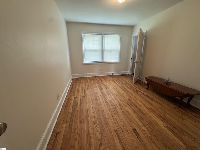 422 E Savannah St, Calhoun Falls, SC 29628 - unfurnished room with wood finished floors and baseboards