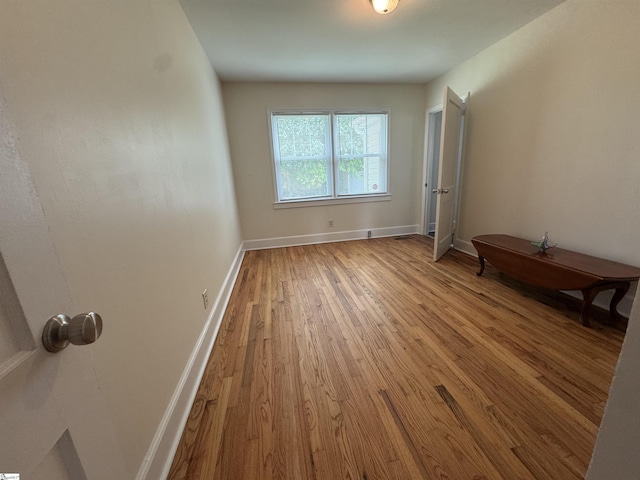 422 E Savannah St, Calhoun Falls, SC 29628 - spare room with wood finished floors and baseboards