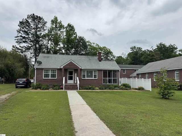 422 E Savannah St, Calhoun Falls, SC 29628 - ranch-style home with brick siding and a chimney