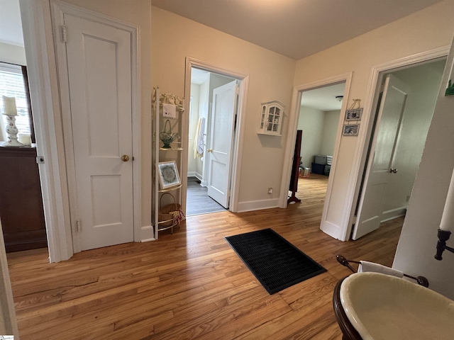 422 E Savannah St, Calhoun Falls, SC 29628 - hall featuring wood finished floors and baseboards