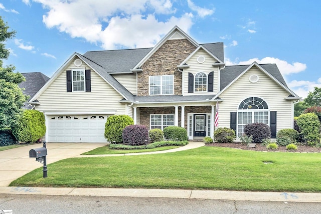 508 Inner Banks Rd, Boiling Springs, SC 29316 - traditional home featuring driveway, stone siding, a front yard, and an attached garage
