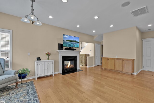 508 Inner Banks Rd, Boiling Springs, SC 29316 - living area featuring light wood finished floors, baseboards, a fireplace with flush hearth, and recessed lighting