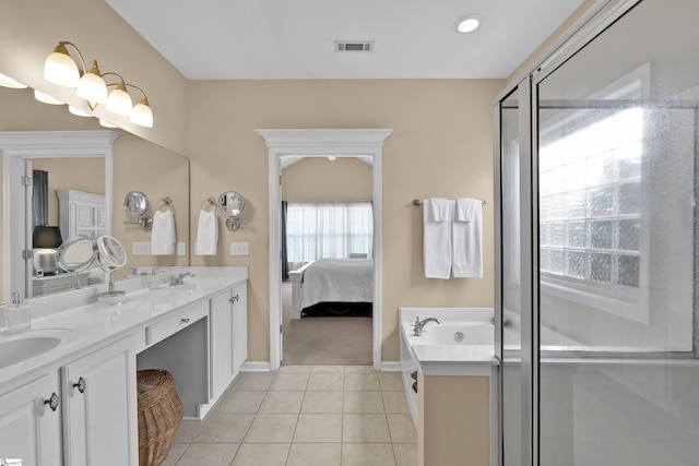 508 Inner Banks Rd, Boiling Springs, SC 29316 - ensuite bathroom with baseboards, tile patterned floors, double vanity, a stall shower, and a bath