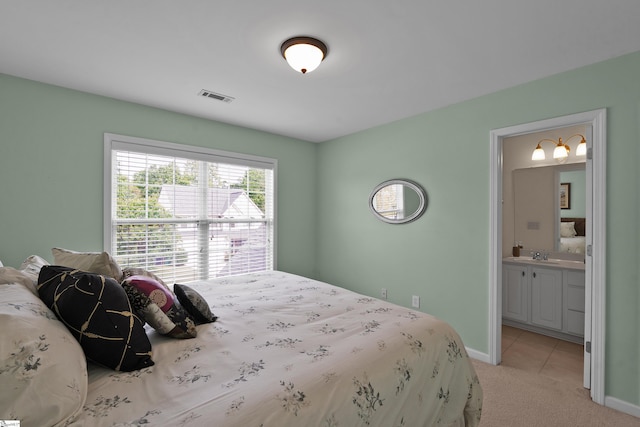 508 Inner Banks Rd, Boiling Springs, SC 29316 - bedroom with light colored carpet, ensuite bathroom, baseboards, and a sink