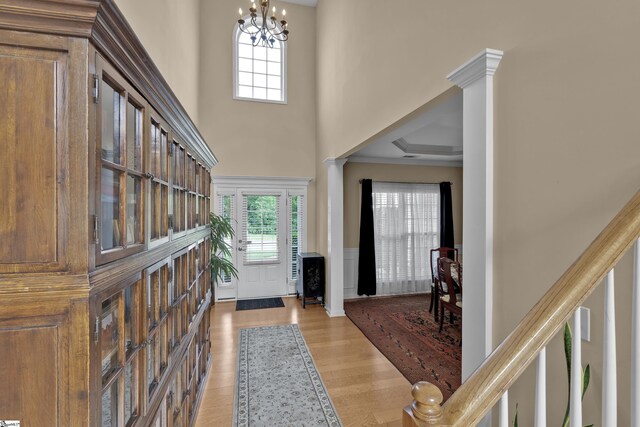 508 Inner Banks Rd, Boiling Springs, SC 29316 - foyer entrance featuring a wainscoted wall, light wood-style flooring, a chandelier, a decorative wall, and decorative columns