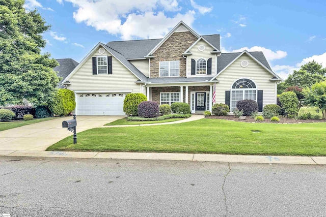 508 Inner Banks Rd, Boiling Springs, SC 29316 - traditional home featuring concrete driveway, stone siding, an attached garage, and a front lawn