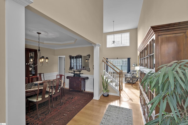 508 Inner Banks Rd, Boiling Springs, SC 29316 - entryway featuring a chandelier, light wood-style flooring, a wainscoted wall, a tray ceiling, and ornamental molding