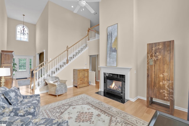 508 Inner Banks Rd, Boiling Springs, SC 29316 - living room with a high ceiling, wood finished floors, stairs, a fireplace, and ceiling fan