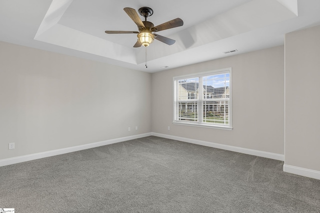 9 Amber Oaks Dr, Greer, SC 29651 - spare room featuring a raised ceiling, carpet flooring, baseboards, and ceiling fan