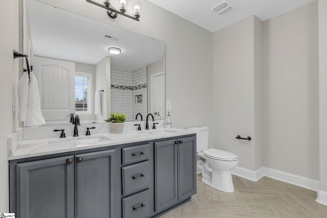 9 Amber Oaks Dr, Greer, SC 29651 - full bathroom featuring toilet, double vanity, a shower, and baseboards