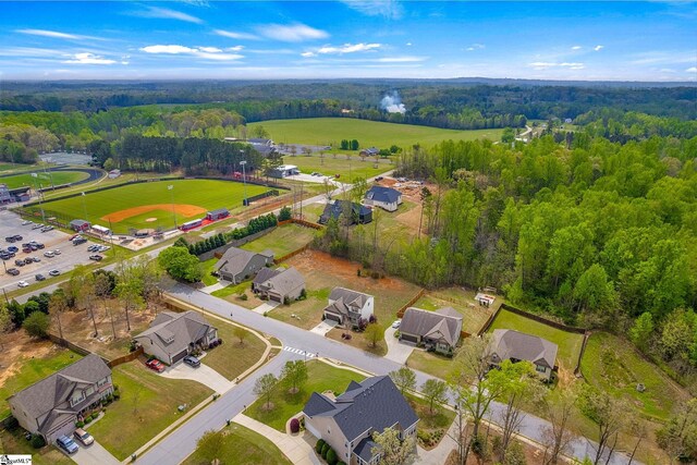 9 Amber Oaks Dr, Greer, SC 29651 - aerial overview of property's location with a heavily wooded area and nearby suburban area