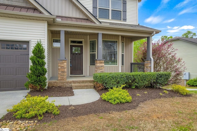 9 Amber Oaks Dr, Greer, SC 29651 - doorway to property with board and batten siding, a porch, a standing seam roof, metal roof, and stone siding