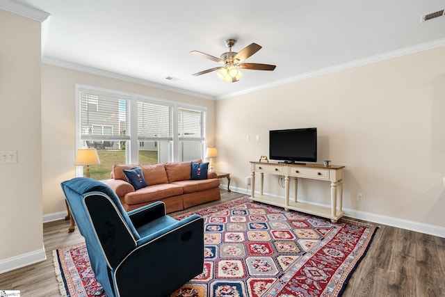 319 Sudduth Farms Dr, Greer, SC 29650 - living room with wood finished floors, ceiling fan, baseboards, and crown molding