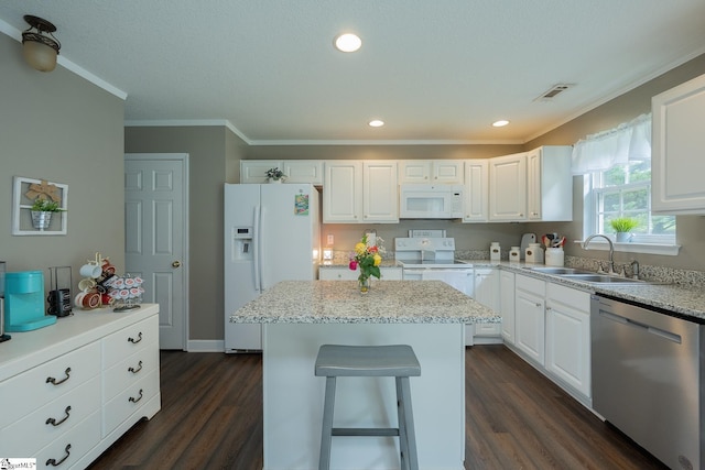 1198 Dalrymple Rd, Anderson, SC 29621 - kitchen with white appliances, a sink, dark wood-type flooring, ornamental molding, and white cabinets