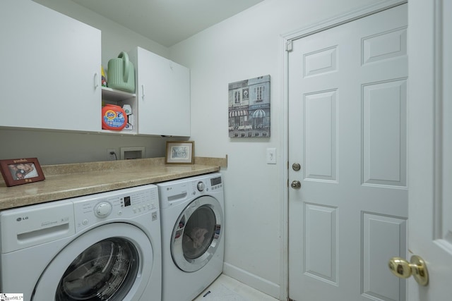 1198 Dalrymple Rd, Anderson, SC 29621 - laundry area with washing machine and dryer, cabinet space, light tile patterned floors, and baseboards