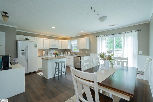 1198 Dalrymple Rd, Anderson, SC 29621 - dining space with ornamental molding, dark wood-style flooring, recessed lighting, and a textured ceiling