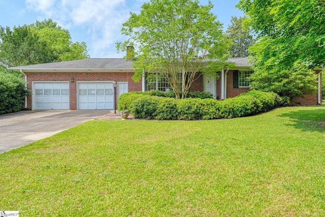 129 E Main St, Duncan, SC 29334 - single story home featuring an attached garage, concrete driveway, brick siding, a front lawn, and a chimney