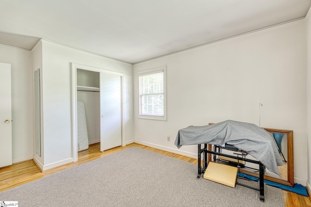 129 E Main St, Duncan, SC 29334 - bedroom with wood finished floors, crown molding, baseboards, and a closet