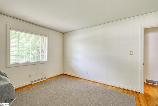 129 E Main St, Duncan, SC 29334 - empty room featuring baseboards, light wood-style flooring, and ornamental molding