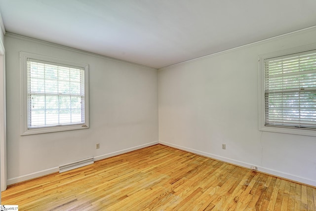 129 E Main St, Duncan, SC 29334 - unfurnished room featuring light wood-style flooring, baseboards, and ornamental molding